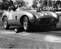 image for Nadeau Bourgeault's re-bodied Frazer-Nash LeMans Replica he formed for James R. Lowe in 1956, at the wheel here. Lowe soon sold this car and it burned at the Paramount Ranch track in Southern California in December 1957. Note the tail line that is a simil